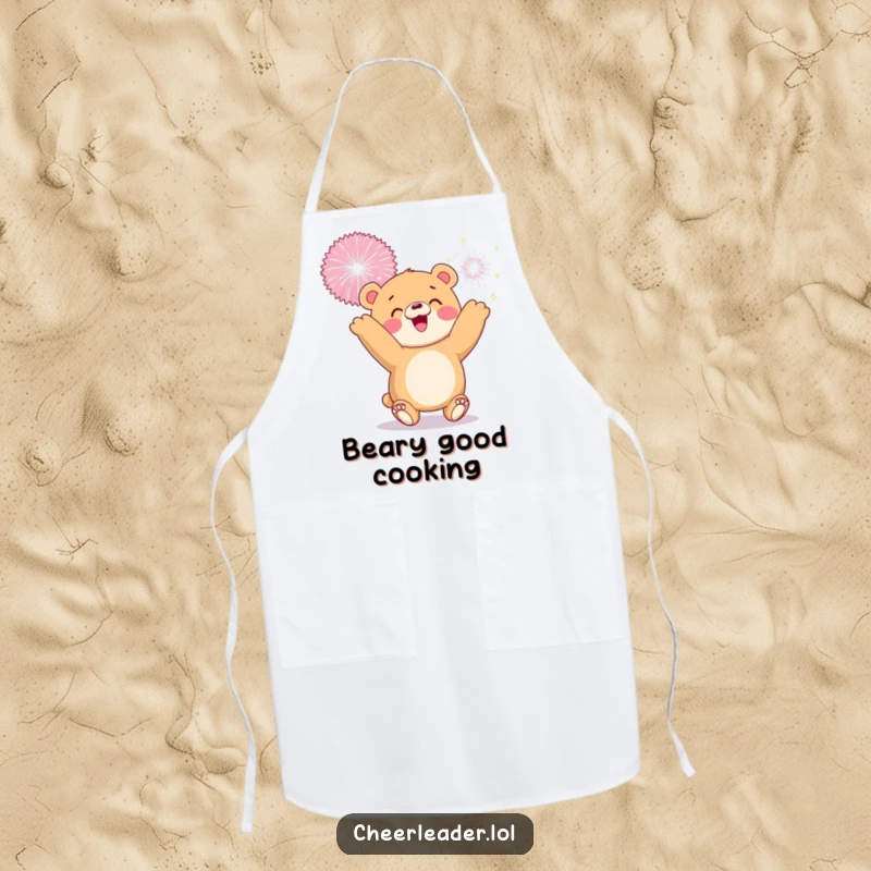 Funny apron with a smiling bear cub tossing a giant sparkly pom-pom, ideal for adding joyful fun to cooking.