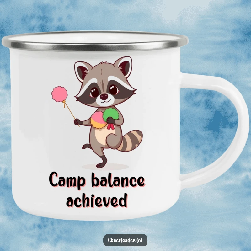 Funny raccoon camping mug showing a curious animal balancing with pom-poms, perfect for outdoor use with humorous cheer.