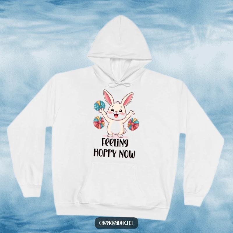 Funny happy rabbit cheering with pom-poms, wearing a cozy hoodie, cute animal design.