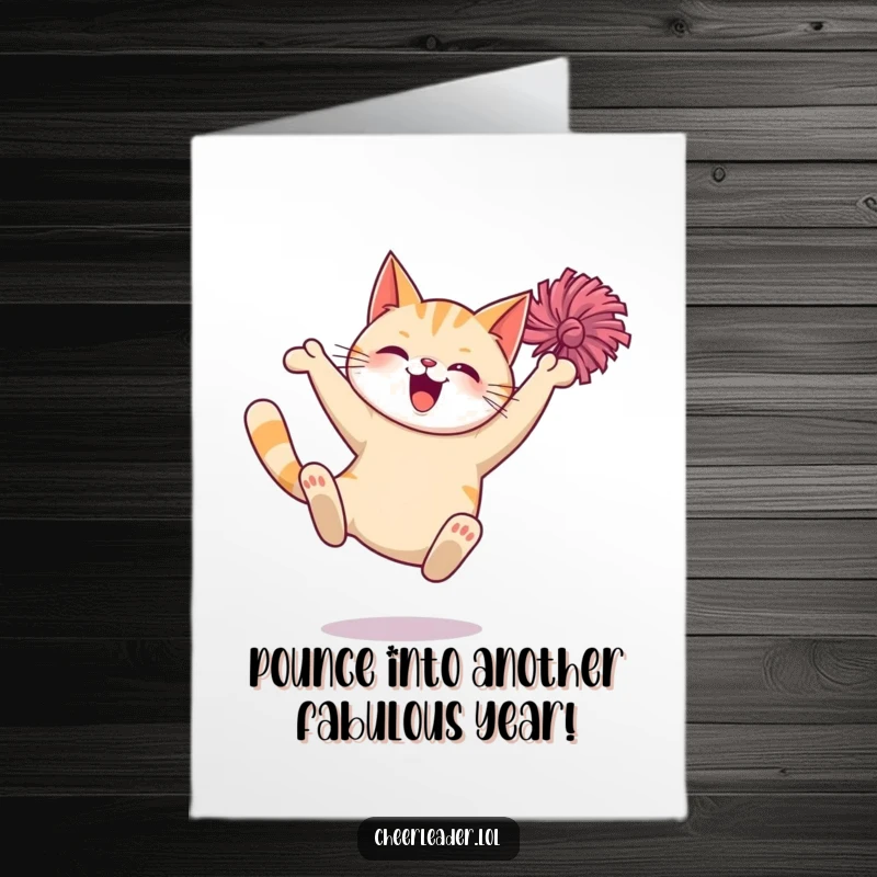 Funny Free Printable Birthday Card: Giggling cat mid-air leap with pom-poms, celebrating with joy.