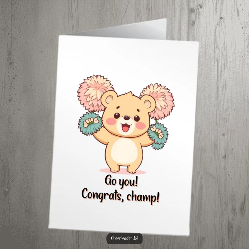 Funny free printable congratulations card depicting a happy bear cub energetically waving large, fluffy pom-poms in celebration.