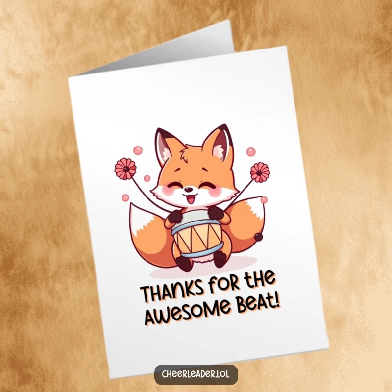 Funny Free Printable Fox Thank You Card: A fox with pom-poms enthusiastically playing a tiny drum, sending gratitude.