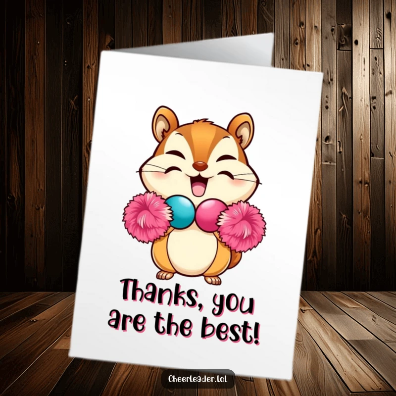 Funny Free Printable Thank You Card: Chipmunk makes heart with pom-poms, sending heartfelt thanks, perfect DIY.