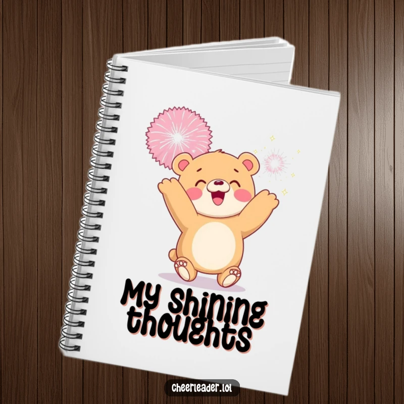 Funny notebook cover showing a smiling bear cub tossing a giant sparkly pom-pom, perfect for notes and ideas.