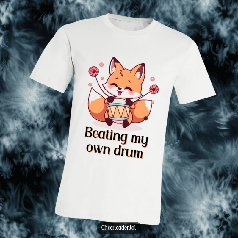 Funny fox playing a tiny drum with pom-poms, looking energetic and musical, on a cool t-shirt.